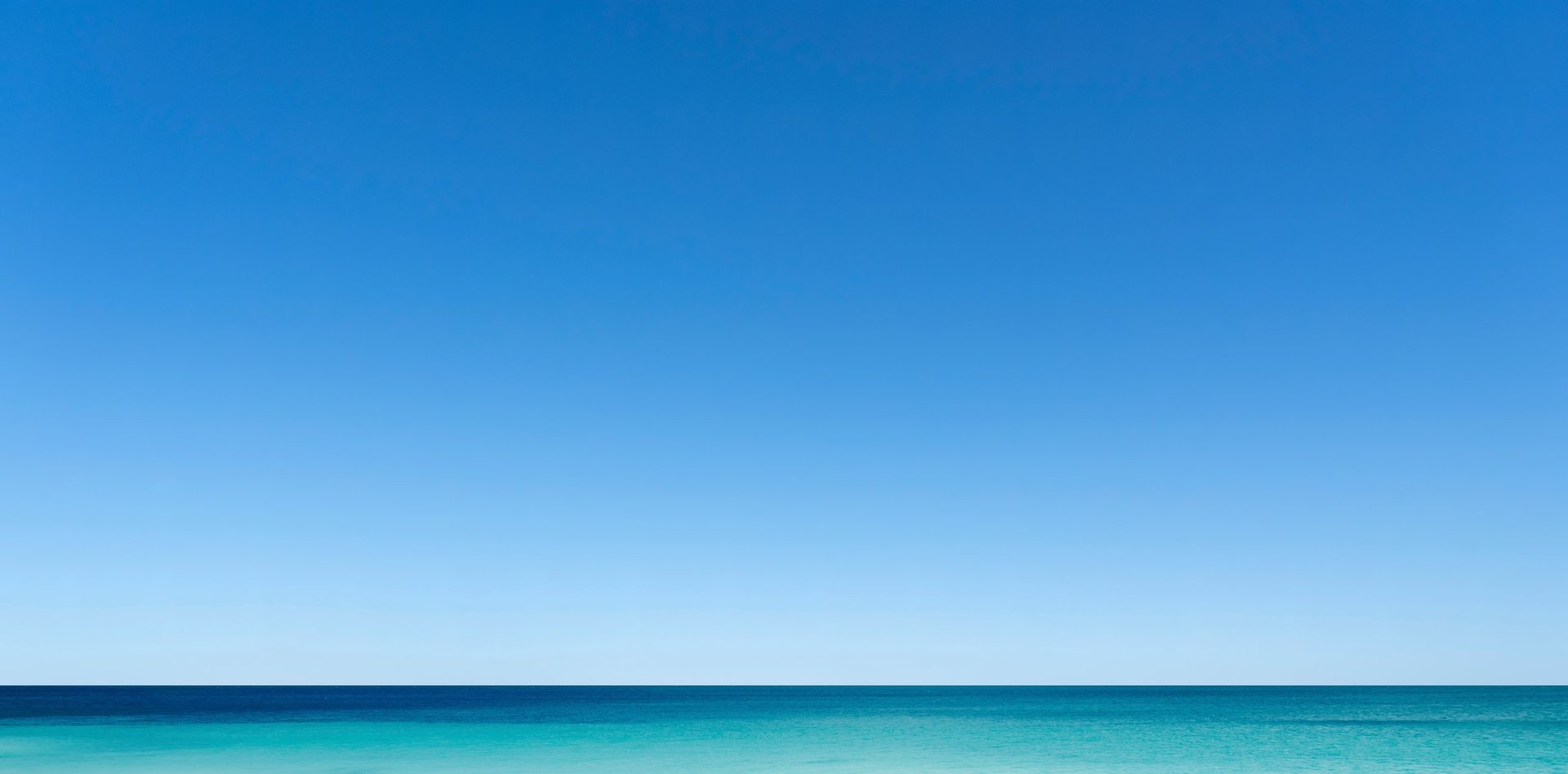Clear turquoise water and blue sky Florida beach